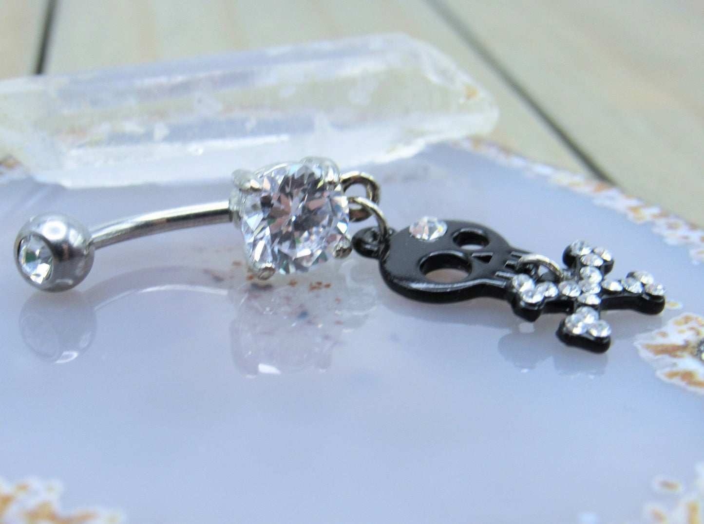 Black skull dangle belly button piercing ring 14g cz gemstones prong set studded crossbone navel bar - Siren Body Jewelry