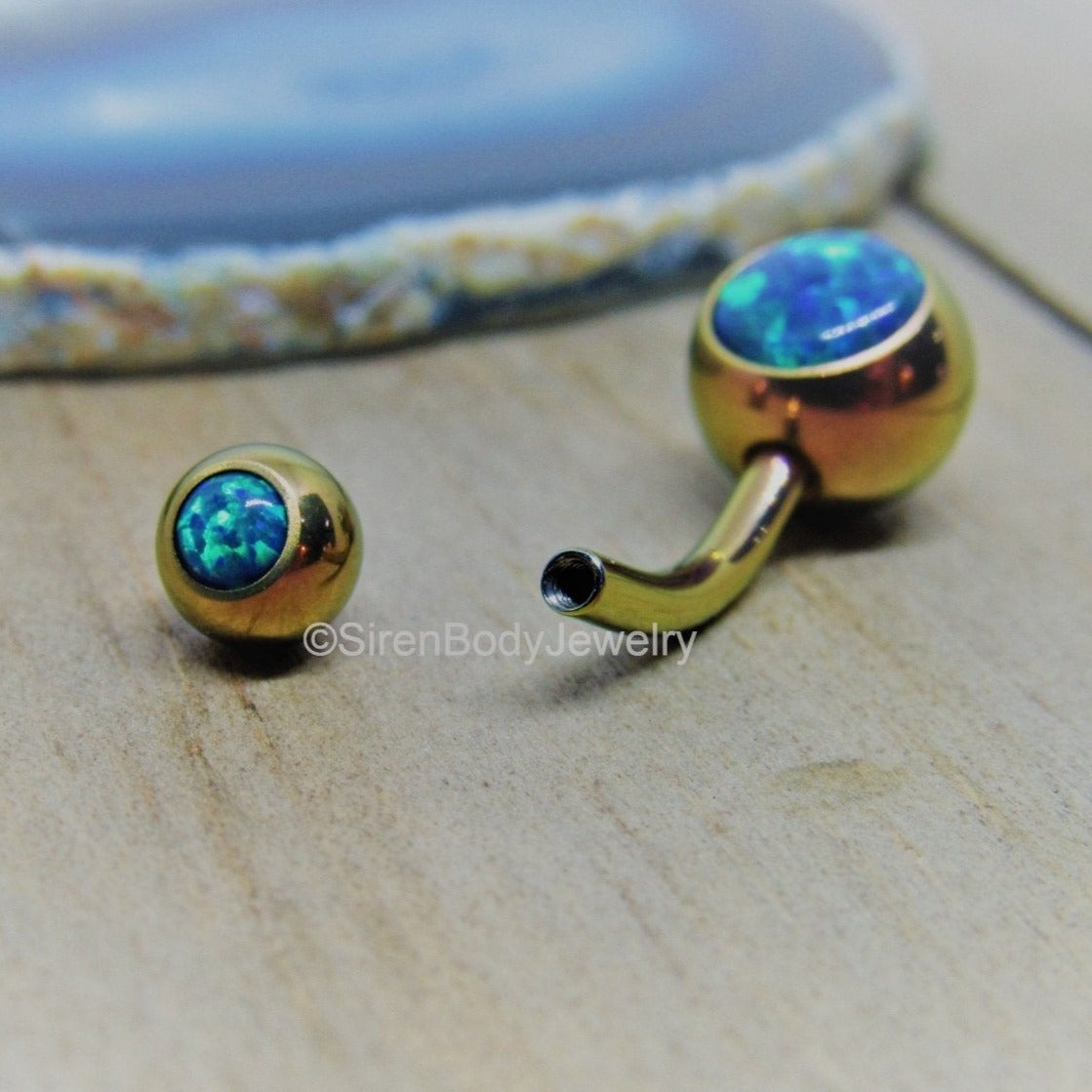 14g titanium blue opal belly button piercing curve