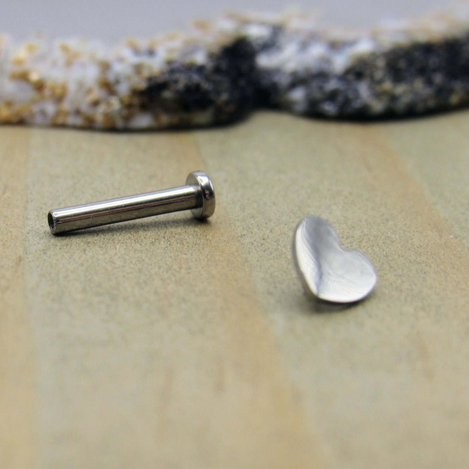 https://sirenbodyjewelry.com/cdn/shop/products/16g-heart-titanium-flat-back-labret-stud-earring-14-38-length-internally-threaded-helix-cartilage-earlobe-lip-ring-172068.jpg?v=1673335390&width=1946