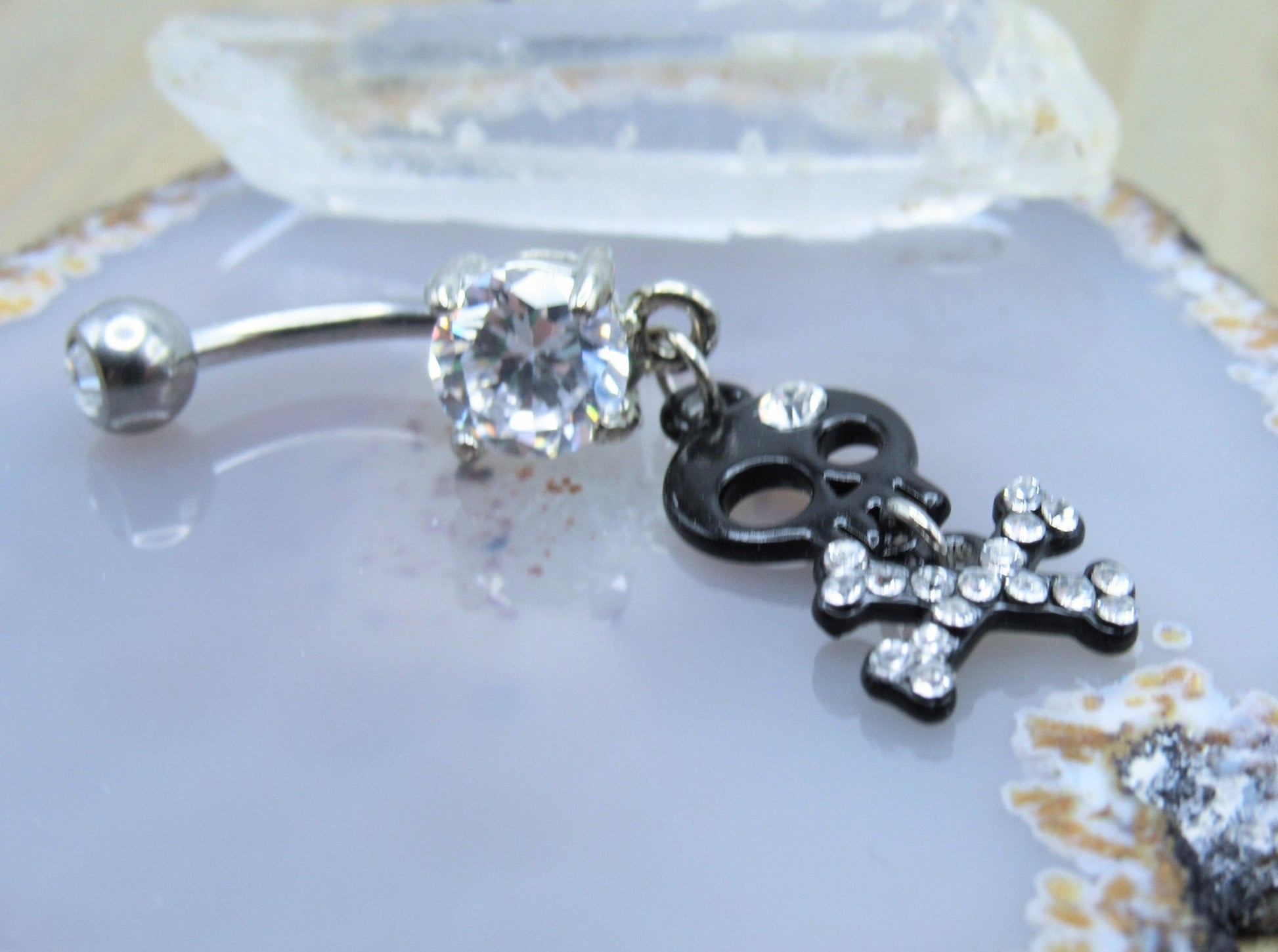 Black skull dangle belly button piercing ring 14g cz gemstones prong set studded crossbone navel bar - Siren Body Jewelry