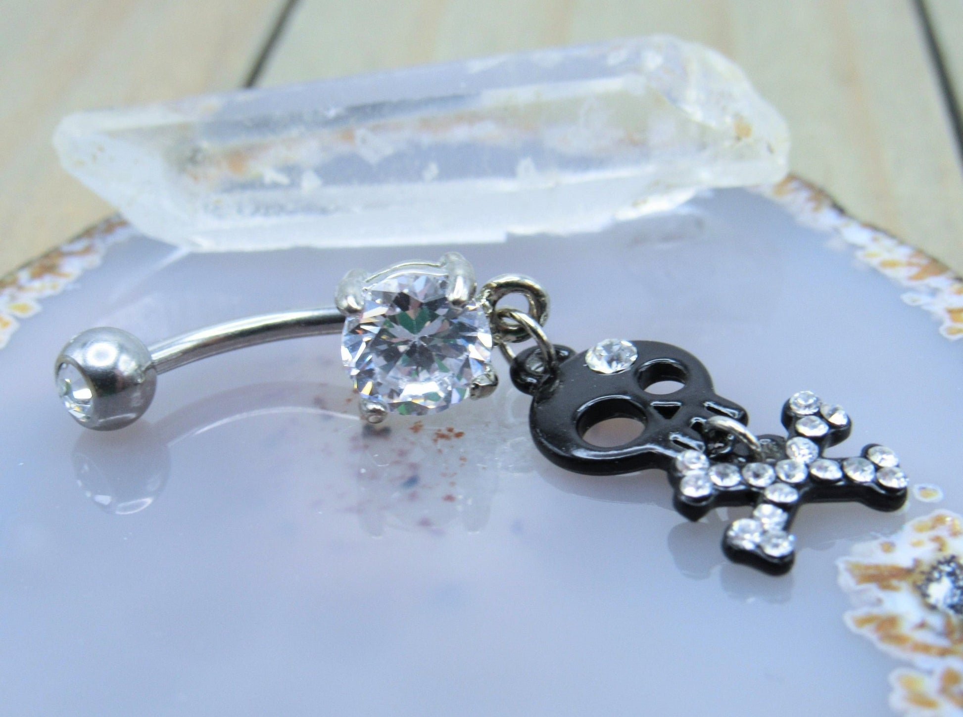 Black skull dangle belly button piercing ring 14g cz gemstones prong set studded crossbone navel bar - Siren Body Jewelry
