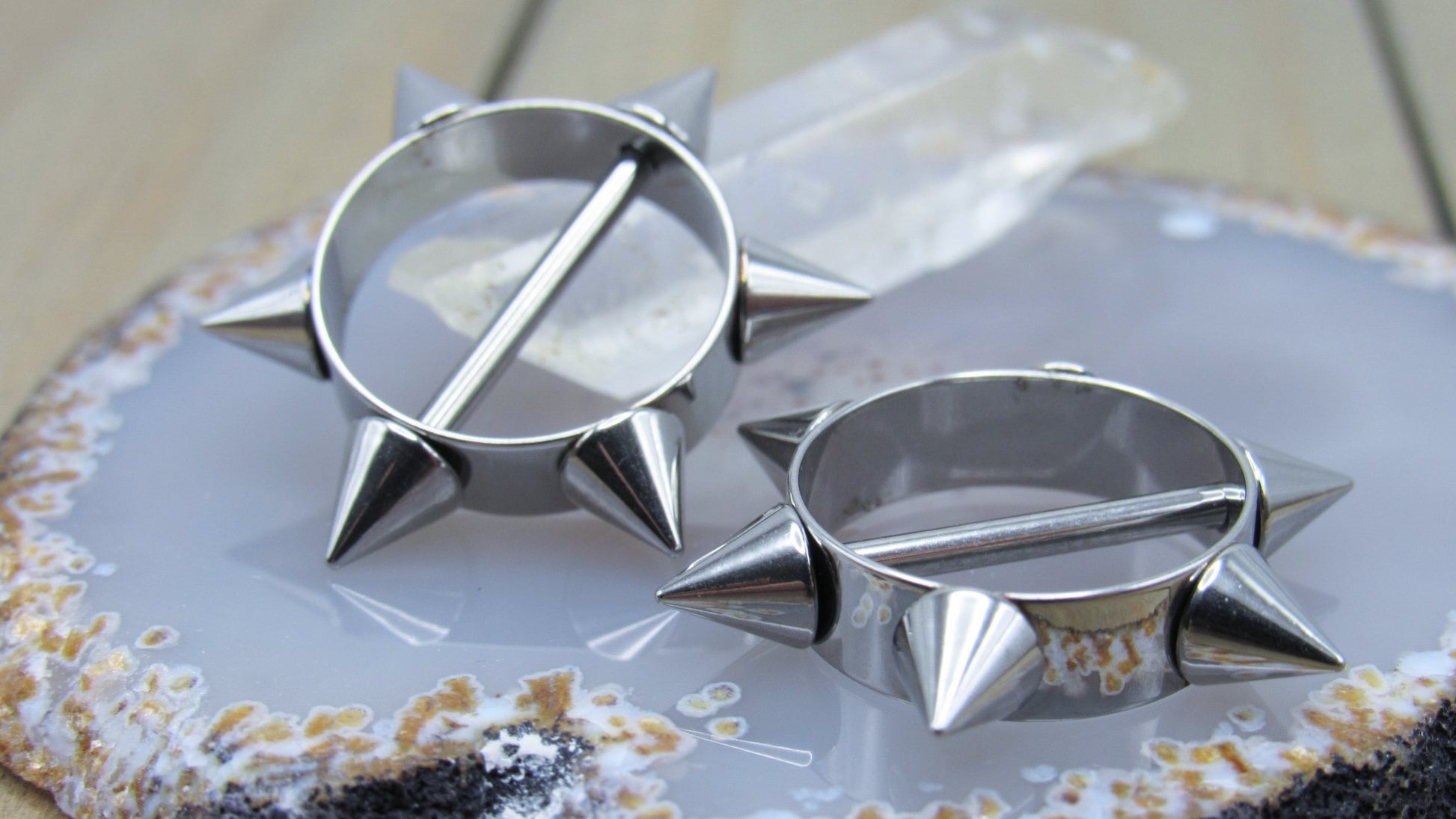 https://sirenbodyjewelry.com/cdn/shop/products/silver-spikes-nipple-piercing-shield-set-14g-silver-316l-stainless-steel-straight-externally-threaded-bars-217705.jpg?v=1677703234&width=1946