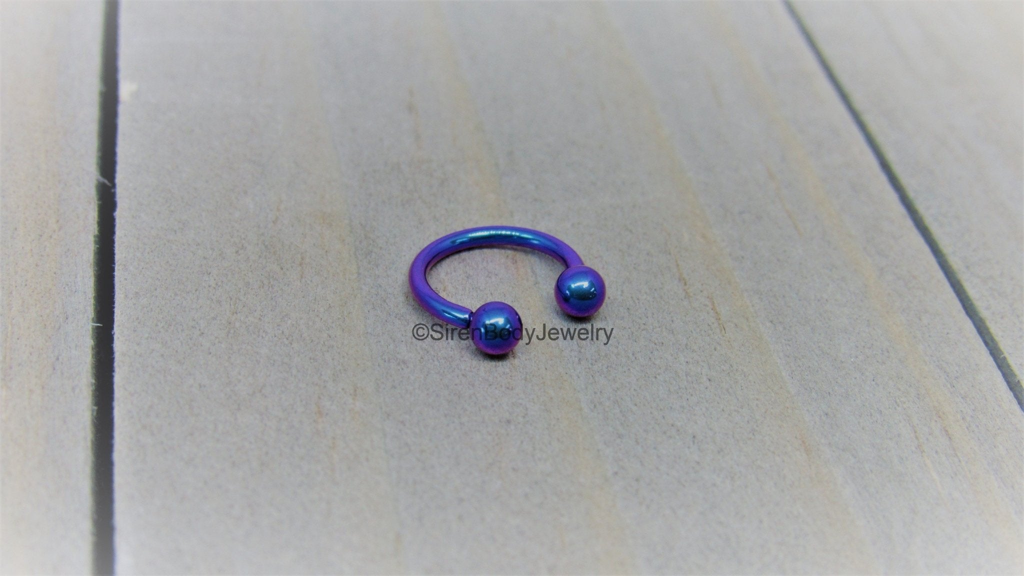 Titanium 16g circular barbell blurple septum horseshoe internally