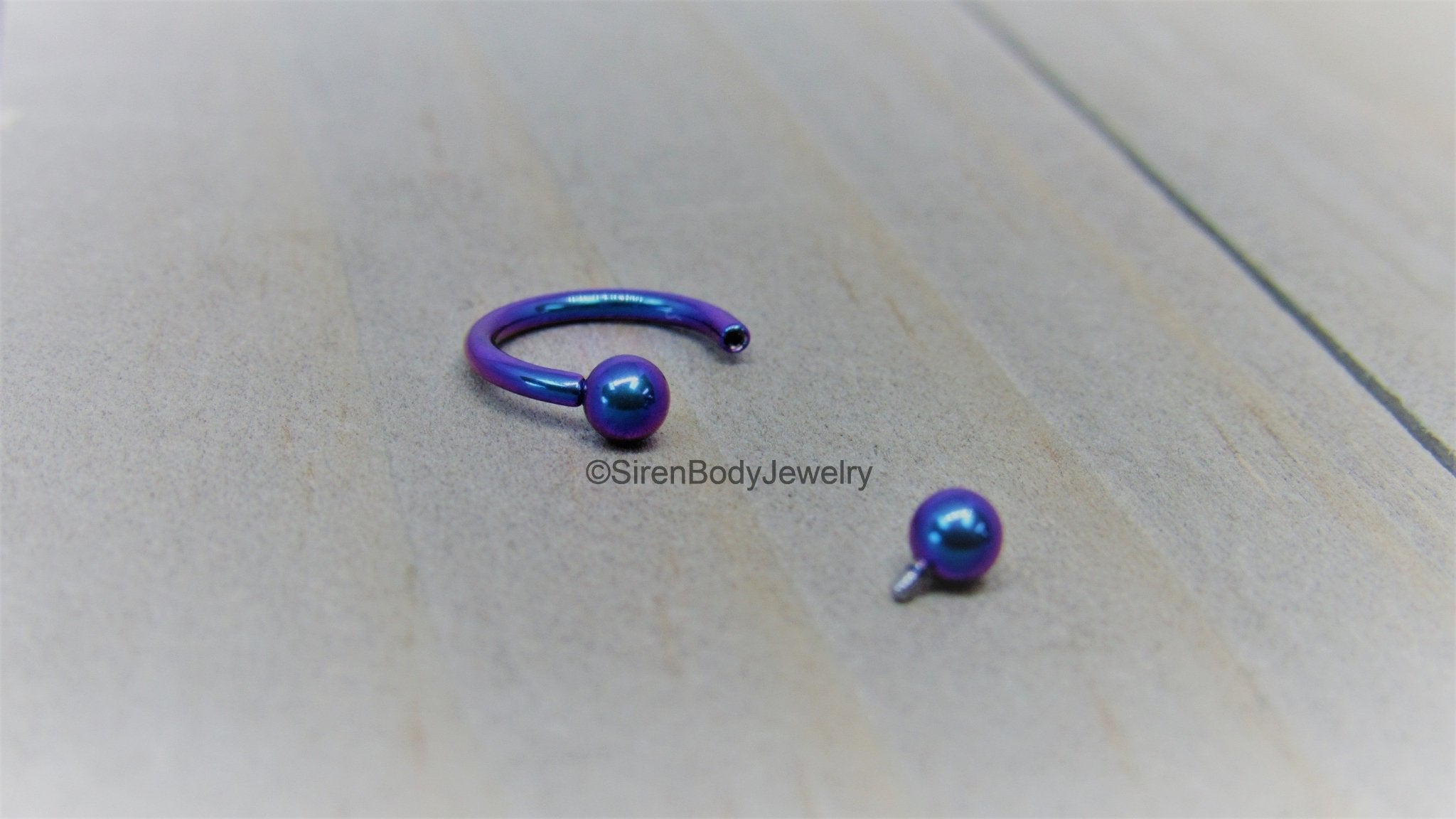 Titanium 16g circular barbell blurple septum horseshoe internally