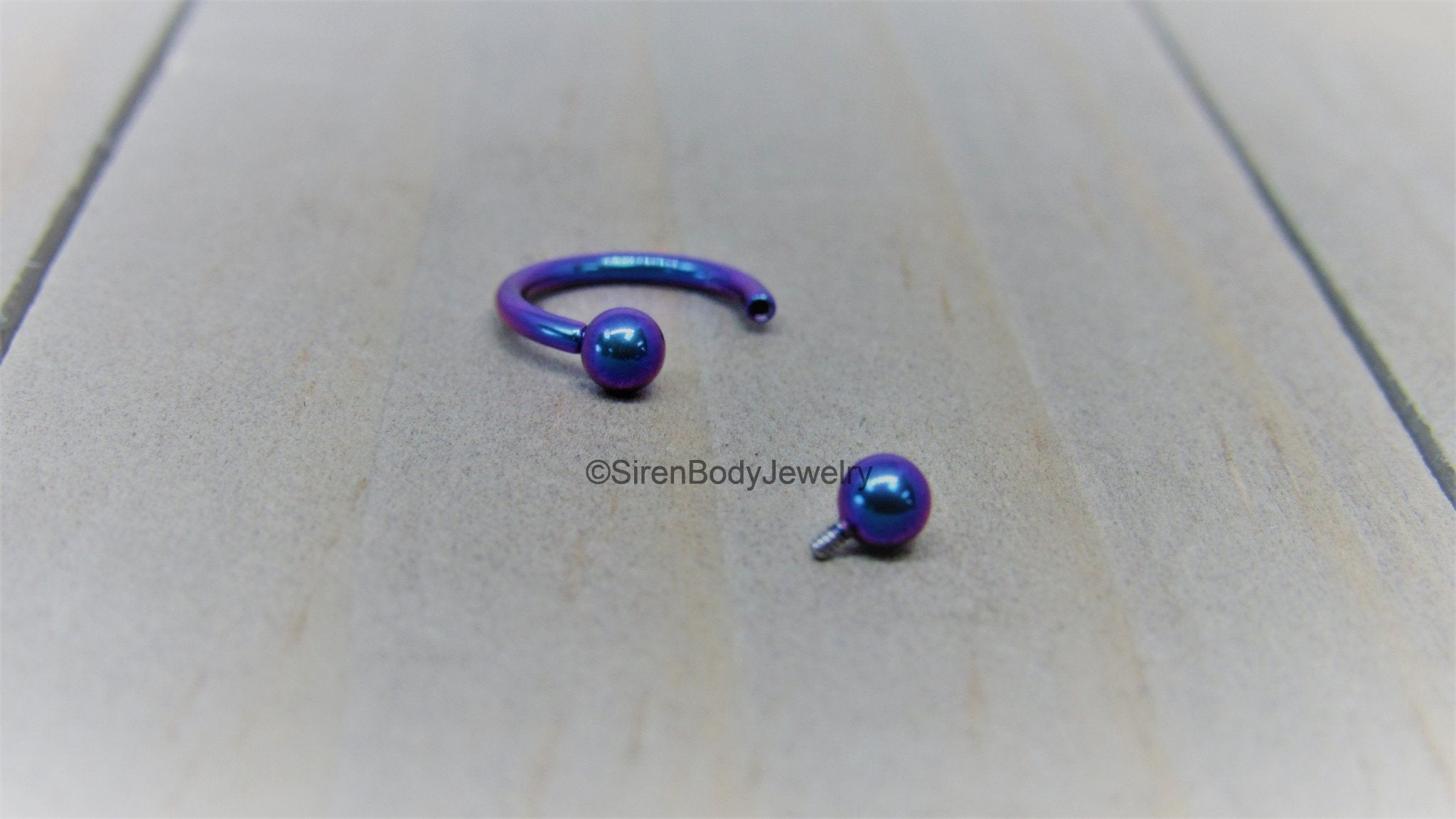 Titanium 16g circular barbell blurple septum horseshoe internally