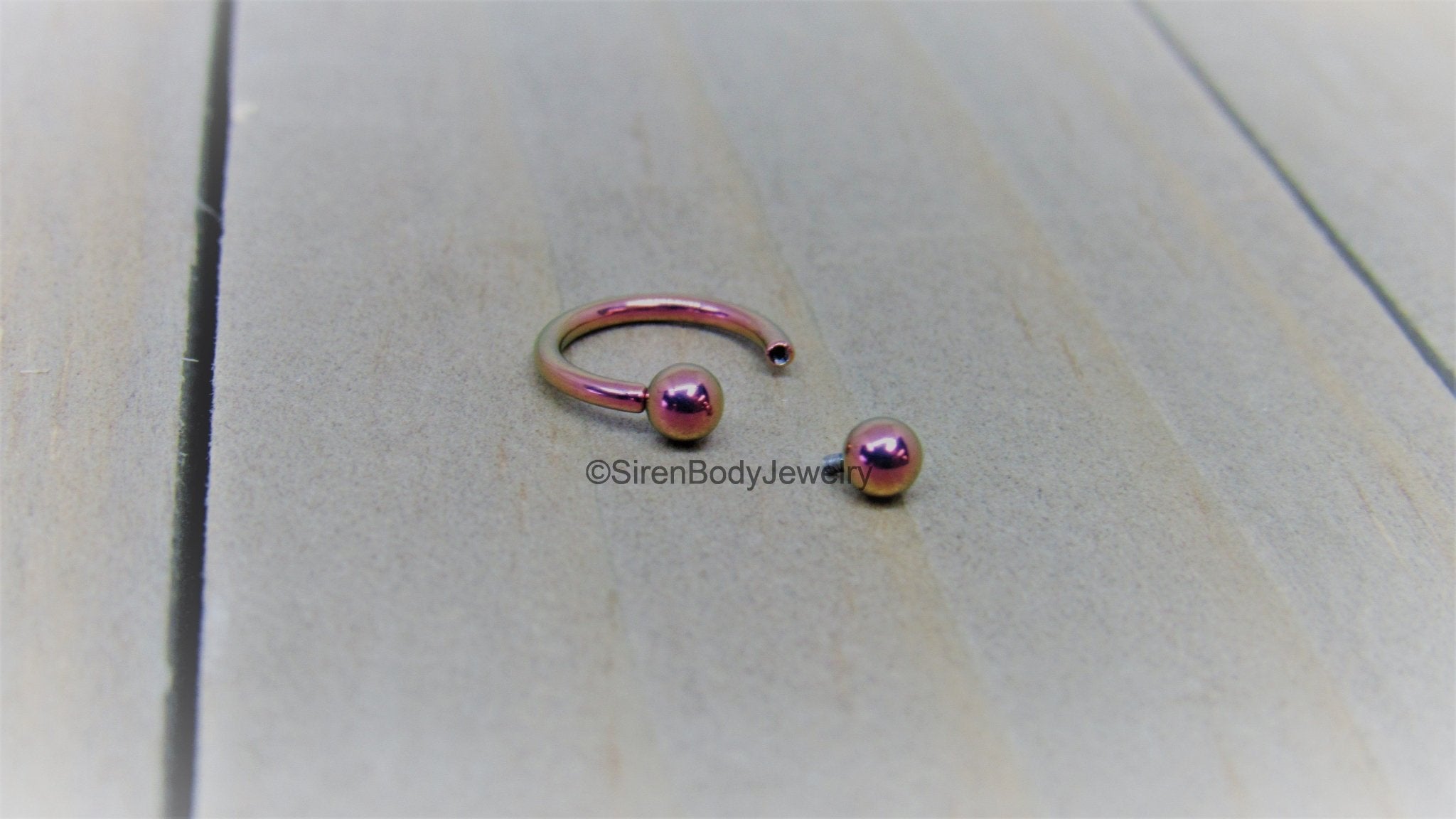 Pink horseshoe online septum